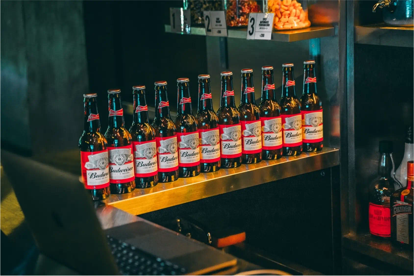 Budweiser bottles displayed in bar for “Free to Be King” campaign